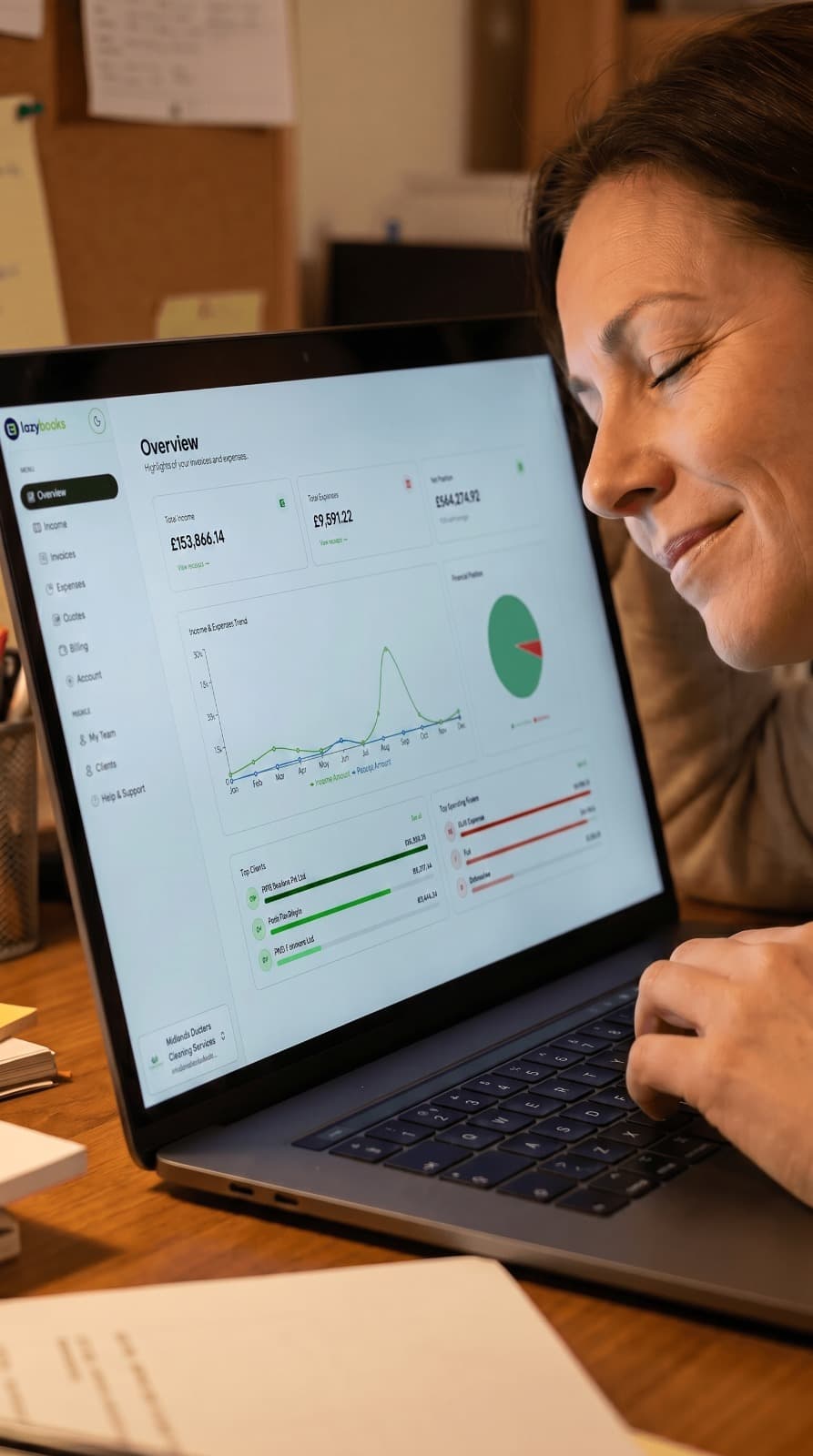A small business owner viewing her Lazybooks dashboard